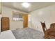 Simple bedroom with a window, doorway, carpeting, and closet provides a comfortable and private space at 4108 S Inca St, Englewood, CO 80110