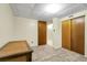 Cozy bedroom featuring wood closet doors and a neutral carpet at 4108 S Inca St, Englewood, CO 80110