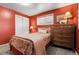 Comfortable bedroom features a large closet, carpeting, and a window for natural light and ventilation at 4108 S Inca St, Englewood, CO 80110