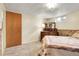 Bedroom featuring neutral carpet, window, dresser and paneling at 4108 S Inca St, Englewood, CO 80110