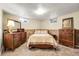 Bedroom featuring neutral carpet, windows and dresser at 4108 S Inca St, Englewood, CO 80110