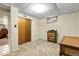 Bedroom featuring neutral carpet, closet, and colorful accent cabinet at 4108 S Inca St, Englewood, CO 80110