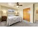Cozy bedroom with neutral tones, carpet flooring, and natural wood door at 4108 S Inca St, Englewood, CO 80110