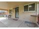 Exterior view of the covered front porch with welcome mat at 4108 S Inca St, Englewood, CO 80110