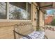Inviting front porch with comfortable seating and brick facade at 4108 S Inca St, Englewood, CO 80110