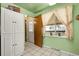 Versatile kitchen area with a window, pantry, and access to the outdoors, offering convenience and functionality at 4108 S Inca St, Englewood, CO 80110