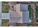 Birds-eye view of the home's roof, driveway, and neatly landscaped backyard at 7412 S Mobile St, Aurora, CO 80016