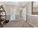 Bedroom with doorways, ample space, neutral decor and shelving at 7412 S Mobile St, Aurora, CO 80016