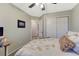 This bedroom offers neutral walls and carpet, built in closet, and nice natural lighting at 7412 S Mobile St, Aurora, CO 80016