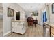 Open-concept dining area adjacent to the kitchen features stylish lighting and comfortable seating at 7412 S Mobile St, Aurora, CO 80016