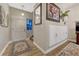 Welcoming entryway with hardwood floors, closet, and staircase leading to the upper level at 7412 S Mobile St, Aurora, CO 80016