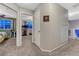 Hallway with doorways to bedrooms and a stairway at 7412 S Mobile St, Aurora, CO 80016