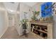 Hallway with beautiful decor and a view of an adjacent hallway and a bathroom at 7412 S Mobile St, Aurora, CO 80016