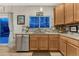 Kitchen showcases stainless steel appliances and stylish backsplash under bright natural light at 7412 S Mobile St, Aurora, CO 80016
