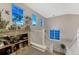 Staircase with multiple windows offering natural light and views, complemented by tasteful decor at 7412 S Mobile St, Aurora, CO 80016