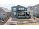 Back exterior view of the home featuring an outdoor patio and landscaped backyard at 4757 Augustine Ct, Castle Rock, CO 80108