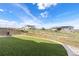 Large backyard with artificial turf, framed garden beds and distant neighborhood views at 4757 Augustine Ct, Castle Rock, CO 80108