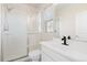 Bright bathroom featuring tile shower, shower head, and a single vanity at 4757 Augustine Ct, Castle Rock, CO 80108