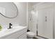 Modern bathroom with walk-in shower, vanity, and white tile at 4757 Augustine Ct, Castle Rock, CO 80108