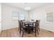 Bright dining room features modern lighting, a dining table with seating for six, and lots of natural light at 4757 Augustine Ct, Castle Rock, CO 80108