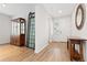Light and bright entryway featuring hardwood floors, a front door with sidelight, and plenty of natural light at 4757 Augustine Ct, Castle Rock, CO 80108