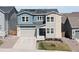 Charming two-story home featuring a well-maintained lawn and a two car garage at 4757 Augustine Ct, Castle Rock, CO 80108