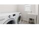 Laundry room featuring a washing machine, a dryer, and a utility sink at 4757 Augustine Ct, Castle Rock, CO 80108