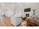 Bright living room boasts vaulted ceilings, a fireplace, and stairs with white railings, creating an open space at 4757 Augustine Ct, Castle Rock, CO 80108