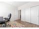 Bright office space features a modern rug, lots of natural light, and a work space at 4757 Augustine Ct, Castle Rock, CO 80108