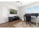 Bright office space features large windows, a ceiling fan, modern lighting, and a work space at 4757 Augustine Ct, Castle Rock, CO 80108