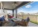 Inviting covered patio with comfortable seating and a stone fire pit, offering expansive neighborhood views at 4757 Augustine Ct, Castle Rock, CO 80108