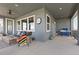 Spacious outdoor patio featuring a built-in grill, ceiling fan, and comfortable seating area at 4757 Augustine Ct, Castle Rock, CO 80108
