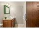 Simple bathroom with vanity and tiled shower/tub at 376 Upham St, Lakewood, CO 80226