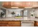 Kitchen with island and view into dining area at 376 Upham St, Lakewood, CO 80226