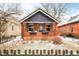 Charming brick bungalow with a welcoming covered porch and well-maintained front yard, perfect for curb appeal at 2688 Julian St, Denver, CO 80211