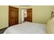 Bedroom with a view of the bathroom and wood flooring at 16507 Oakmoor Pl, Parker, CO 80134