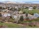 Scenic neighborhood with beautiful homes surrounded by mature trees and green spaces at 10624 W Berry Pl, Littleton, CO 80127