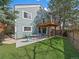 Outdoor living is easy in this backyard with a patio, dining set, and elevated deck at 10624 W Berry Pl, Littleton, CO 80127