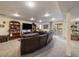 Finished basement featuring a large entertainment area and walk-out access to the yard at 10624 W Berry Pl, Littleton, CO 80127
