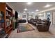 Finished basement with living area, theater seating, and recessed lighting at 10624 W Berry Pl, Littleton, CO 80127