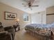 Cozy bedroom featuring a ceiling fan and closet with sliding doors at 10624 W Berry Pl, Littleton, CO 80127