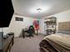 Bedroom with neutral walls, carpet, and lighting and plenty of space at 10624 W Berry Pl, Littleton, CO 80127