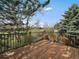 Spacious wooden deck with black metal railing, offering scenic outdoor views at 10624 W Berry Pl, Littleton, CO 80127