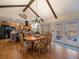 Dining area open to kitchen featuring hardwood floors and lots of natural light at 10624 W Berry Pl, Littleton, CO 80127