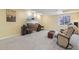 Finished basement featuring plush carpeting, ambient lighting, and a cozy entertainment setup, creating a welcoming space for relaxation at 2864 S Jebel Way, Aurora, CO 80013