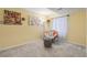 Relaxing basement space with a comfortable chair and soft lighting, creating a cozy reading nook at 2864 S Jebel Way, Aurora, CO 80013