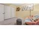 Functional basement with a chair and ottoman, offering versatility and potential for various uses and activities at 2864 S Jebel Way, Aurora, CO 80013