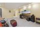 Spacious basement area with comfortable seating and a large TV screen, ideal for entertainment and leisure activities at 2864 S Jebel Way, Aurora, CO 80013