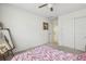 Comfortable bedroom with neutral carpeting, a ceiling fan, and convenient closet access at 2864 S Jebel Way, Aurora, CO 80013