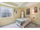 Cozy bedroom featuring soft carpeting, a window, and neutral decor, creating a peaceful and inviting atmosphere at 2864 S Jebel Way, Aurora, CO 80013